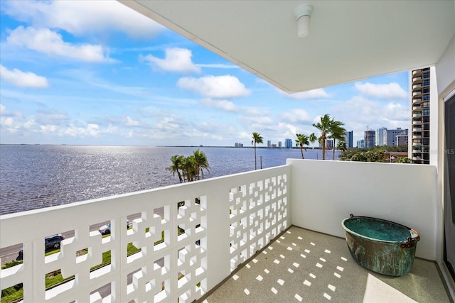 balcony featuring a water view