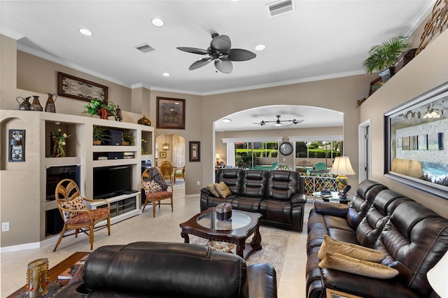 tiled living room featuring ceiling fan and crown molding