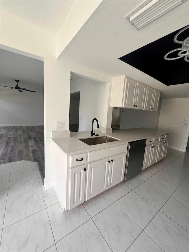 kitchen with sink, ceiling fan, black dishwasher, light hardwood / wood-style floors, and white cabinetry