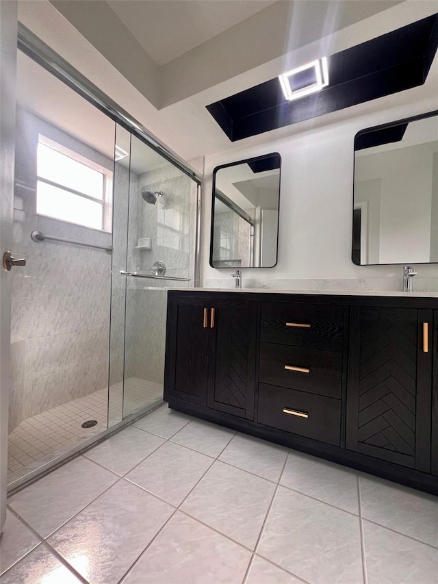 bathroom featuring tile patterned flooring, vanity, and an enclosed shower