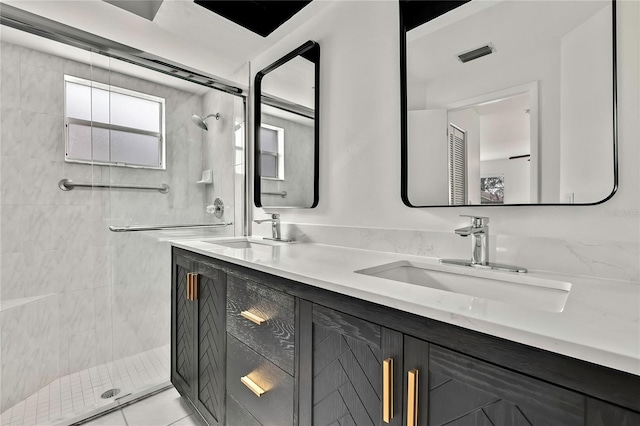 bathroom with vanity and an enclosed shower