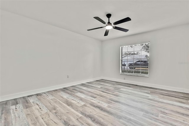 spare room featuring ceiling fan and light wood-type flooring