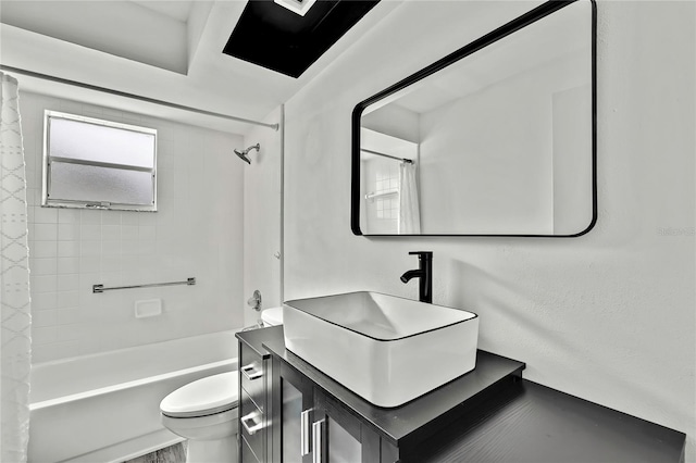 full bathroom featuring vanity, shower / tub combo, and toilet