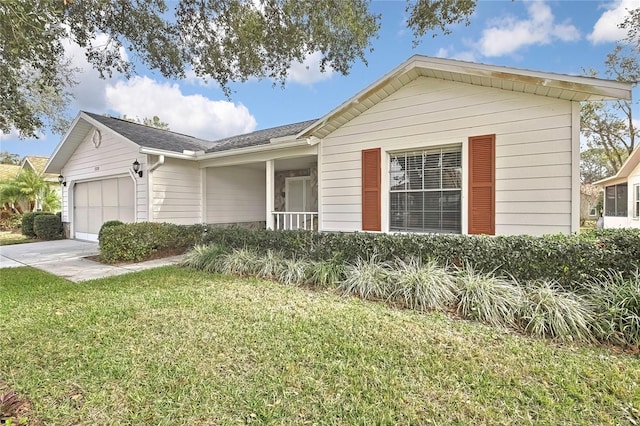 ranch-style home with a garage and a front lawn