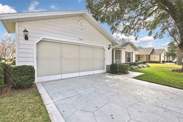 view of front facade featuring a garage and a front lawn