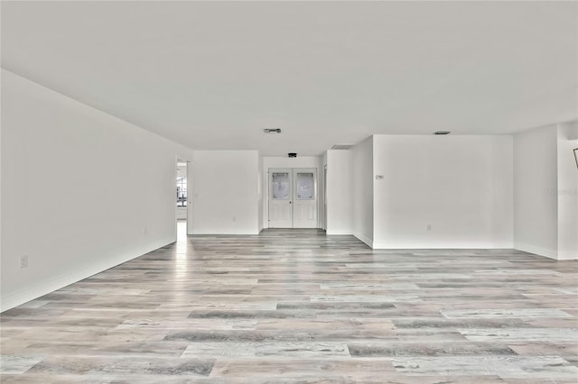 unfurnished living room featuring light hardwood / wood-style flooring