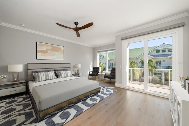 bedroom featuring ceiling fan, light hardwood / wood-style floors, access to exterior, and crown molding