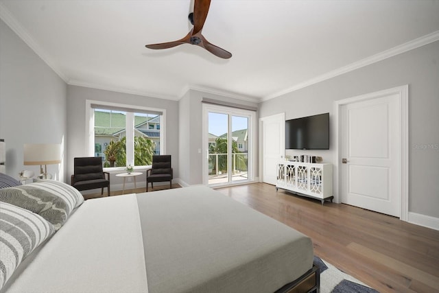 bedroom featuring access to outside, ceiling fan, crown molding, and dark hardwood / wood-style floors