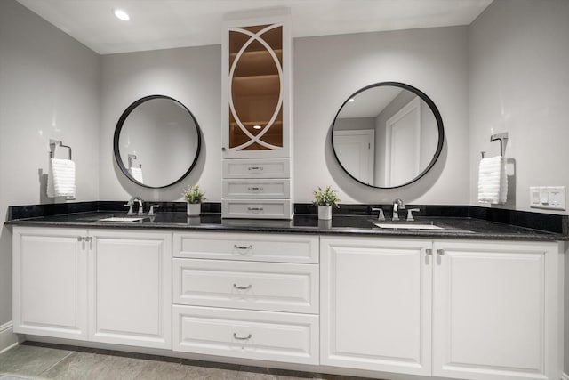 bathroom with tile patterned flooring and vanity