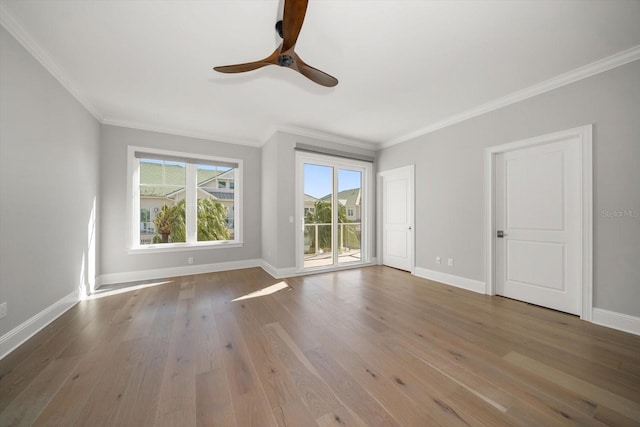 spare room with ceiling fan, hardwood / wood-style floors, and ornamental molding