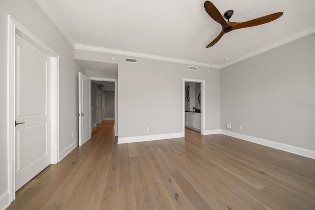 unfurnished bedroom with light hardwood / wood-style flooring, ceiling fan, and crown molding