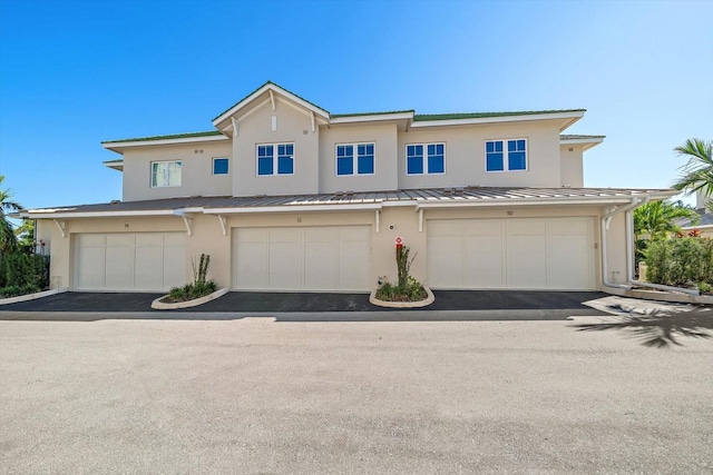 townhome / multi-family property featuring a garage