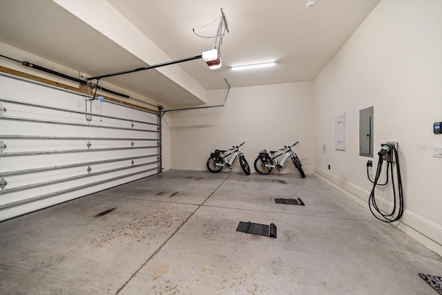 garage with electric panel and a garage door opener