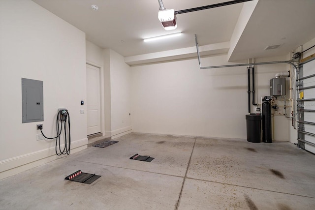 garage featuring electric panel and a garage door opener