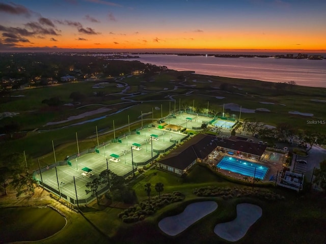 aerial view at dusk with a water view