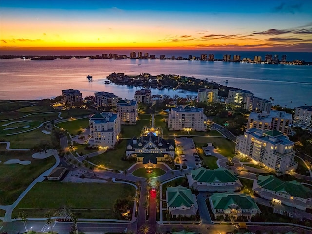 aerial view at dusk with a water view