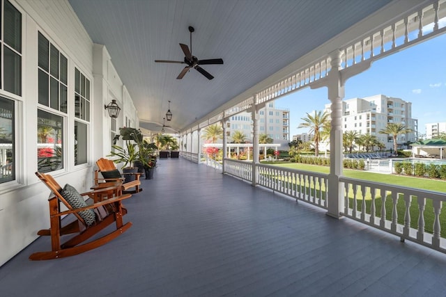 sunroom featuring ceiling fan