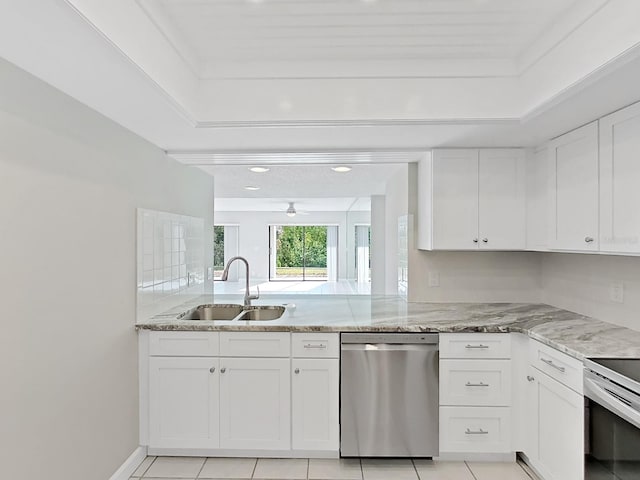 kitchen with sink, ceiling fan, appliances with stainless steel finishes, light stone counters, and white cabinetry