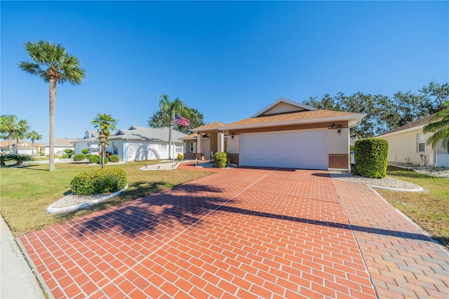 single story home with a front yard and a garage