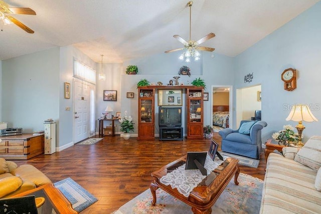 living room with dark hardwood / wood-style flooring, high vaulted ceiling, and ceiling fan