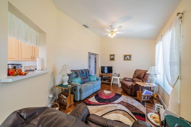 living room featuring hardwood / wood-style flooring and ceiling fan