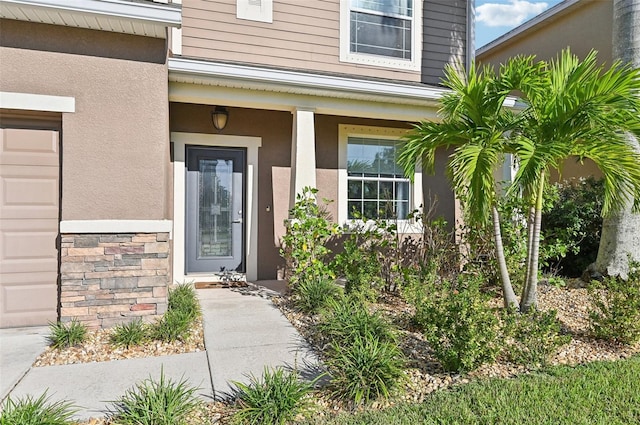 property entrance with a garage