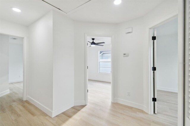 hall with light hardwood / wood-style floors