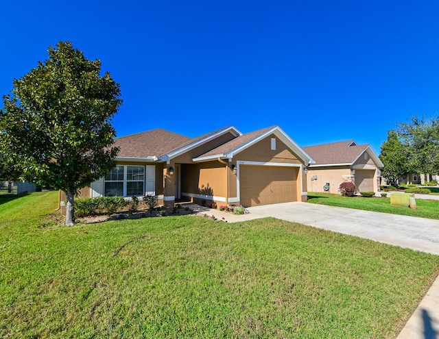 single story home with a garage and a front lawn