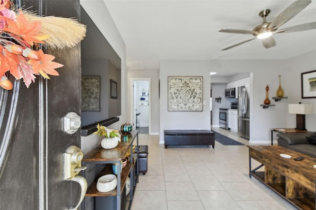 living room featuring ceiling fan and light tile patterned flooring