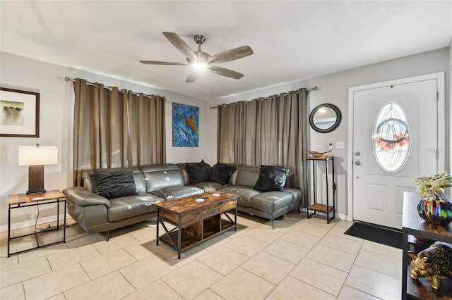 living room featuring light tile patterned floors and ceiling fan