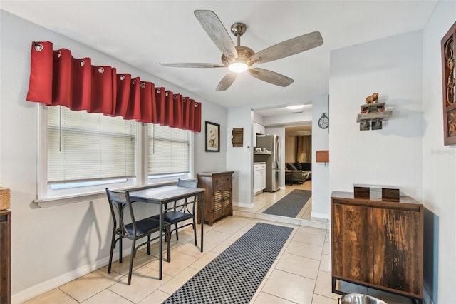 dining room with ceiling fan and light tile patterned floors