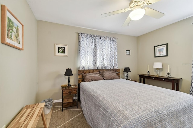 bedroom with ceiling fan and carpet floors