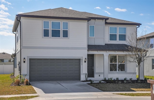 view of front of property with a garage