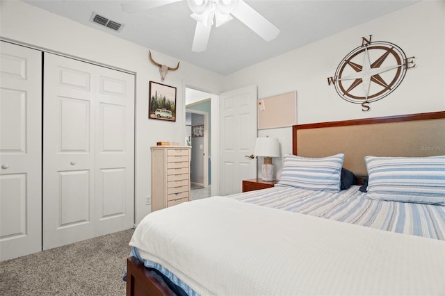 bedroom with a closet, ceiling fan, and carpet flooring