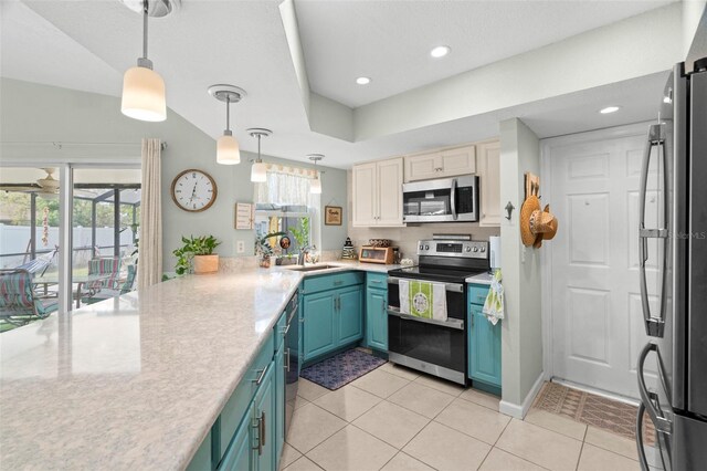 kitchen with pendant lighting, blue cabinets, sink, light tile patterned floors, and stainless steel appliances