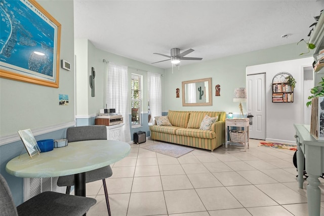 tiled living room featuring ceiling fan