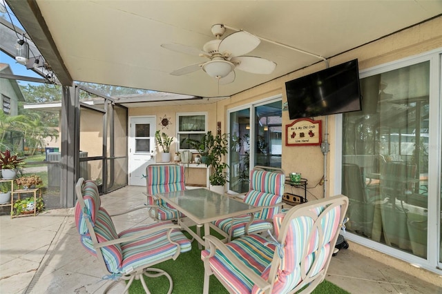 exterior space with ceiling fan