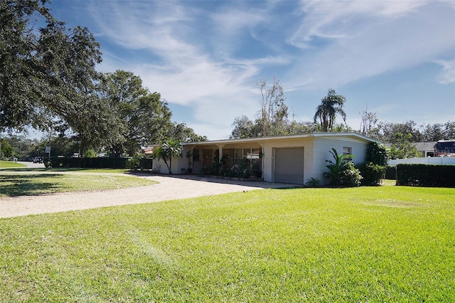 ranch-style home with a front lawn and a carport