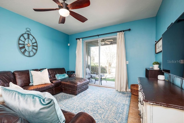 living room featuring ceiling fan and light tile patterned flooring