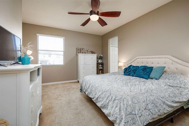 bedroom with carpet, ceiling fan, and a closet