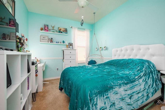 bedroom with light carpet and ceiling fan