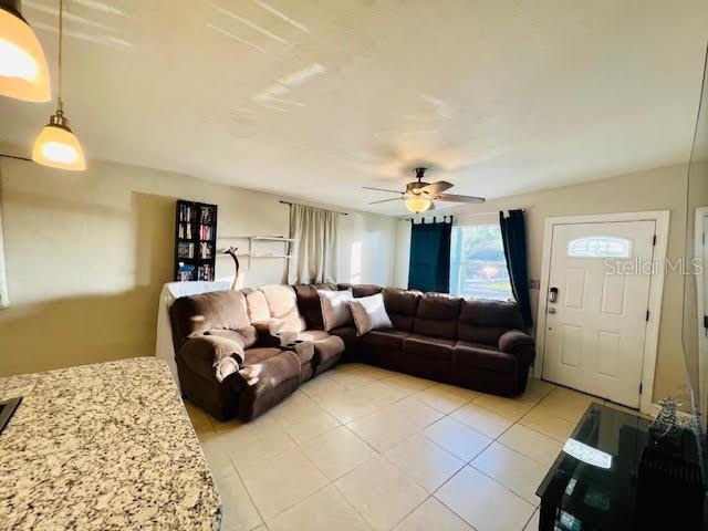 living room featuring ceiling fan