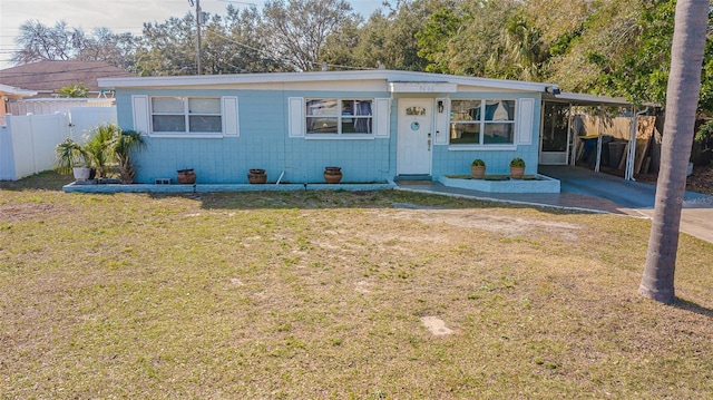 9696 Groveland St, Seminole, FL 33772 - ranch-style house featuring a carport and a front lawn