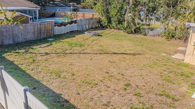 9696 Groveland St, Seminole, FL 33772 - view of yard featuring an outdoor fire pit