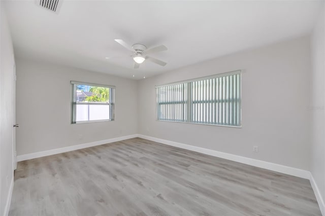 unfurnished room featuring ceiling fan and light hardwood / wood-style floors