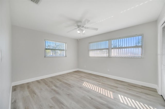 spare room with light hardwood / wood-style flooring and ceiling fan