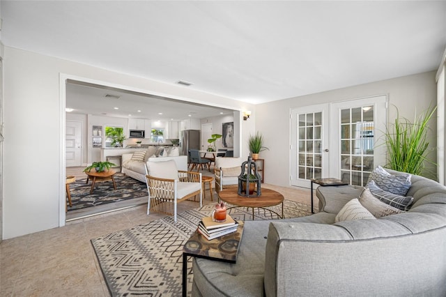 living area with visible vents and french doors