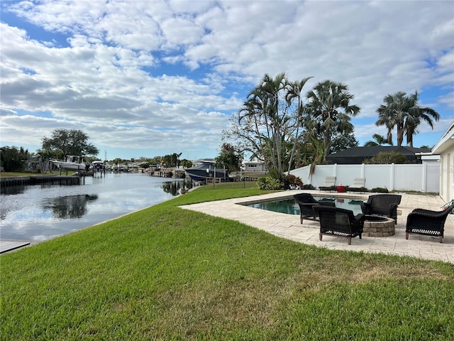 view of yard featuring a water view and a patio area