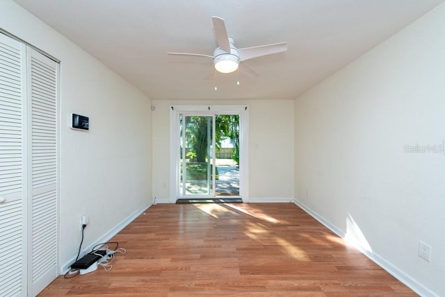 spare room with ceiling fan and light hardwood / wood-style floors