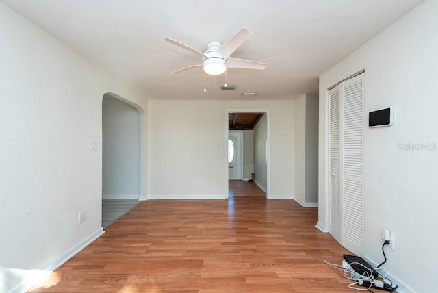 spare room with light hardwood / wood-style flooring and ceiling fan